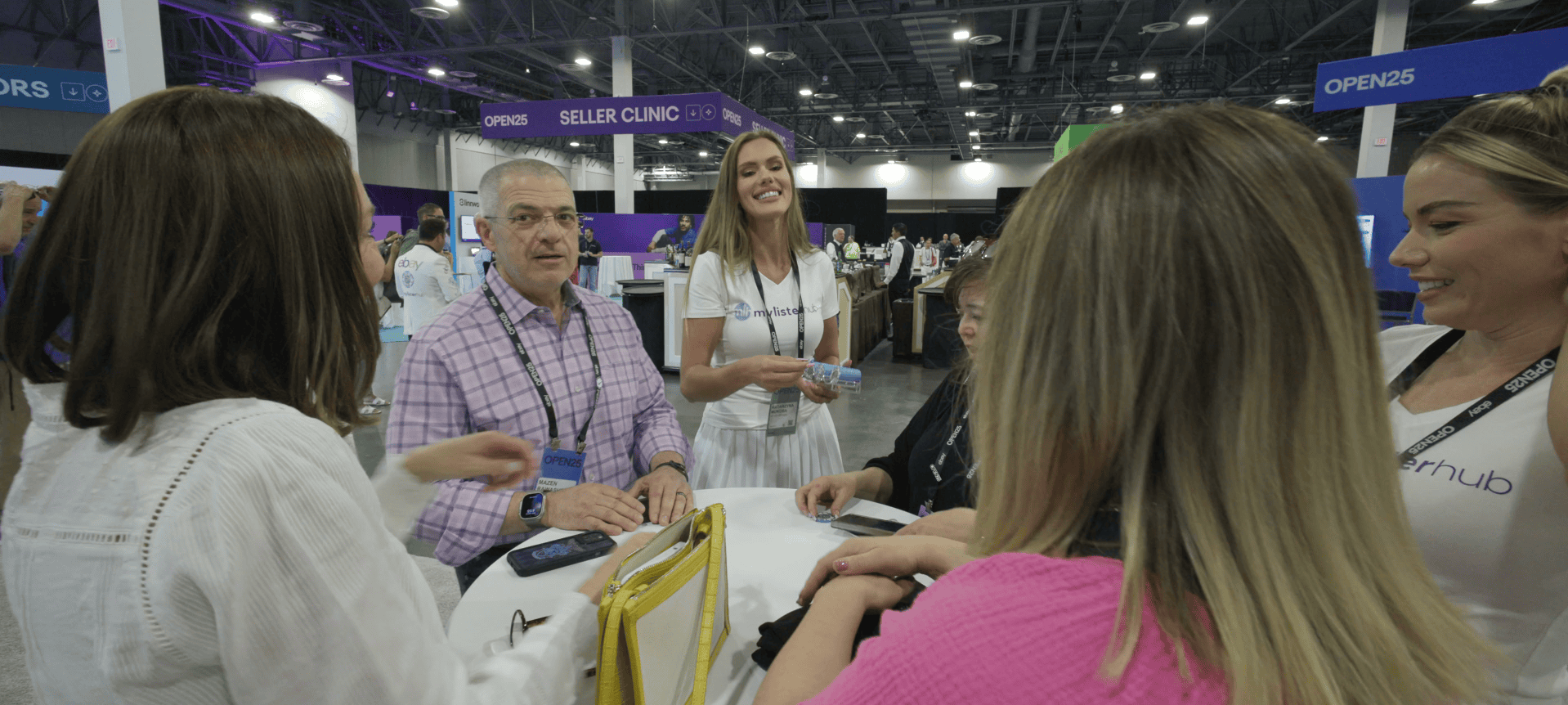 MyListerHub team discussing AI features with sellers during eBay Open 2025 in Las Vegas